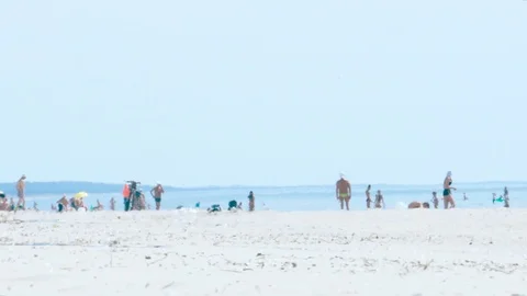View of beach at seaside on hot day. Air shimmering Stock Footage 112609363
