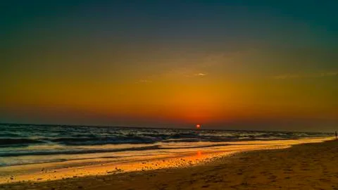 View from the beach on the setting sun Stock Photos