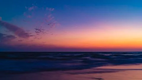 View from the beach on the setting sun Stock Photos