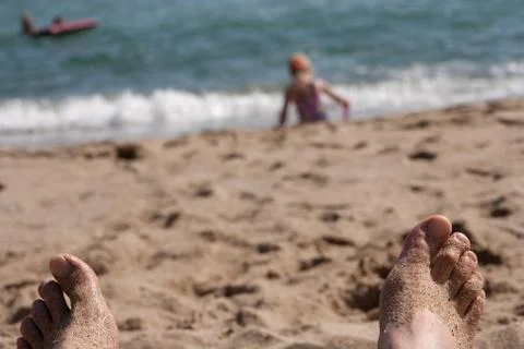 View of the beach from the side of the vacationer. Stock Photos