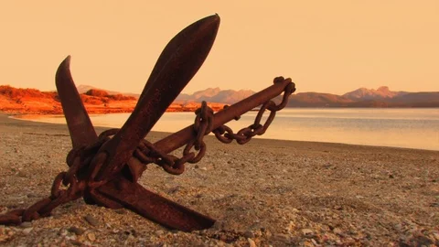 A view of the beach with some rusty elements in the foreground as main Stock Footage 103530259