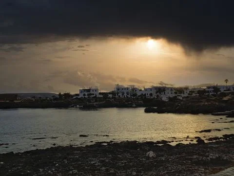 View to the beach at sunset in summer Stock Photos