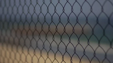 View of the beach through the fence of the grid. Stock Footage 99983568