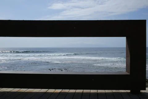 View on the beach through the fence Stock Photos