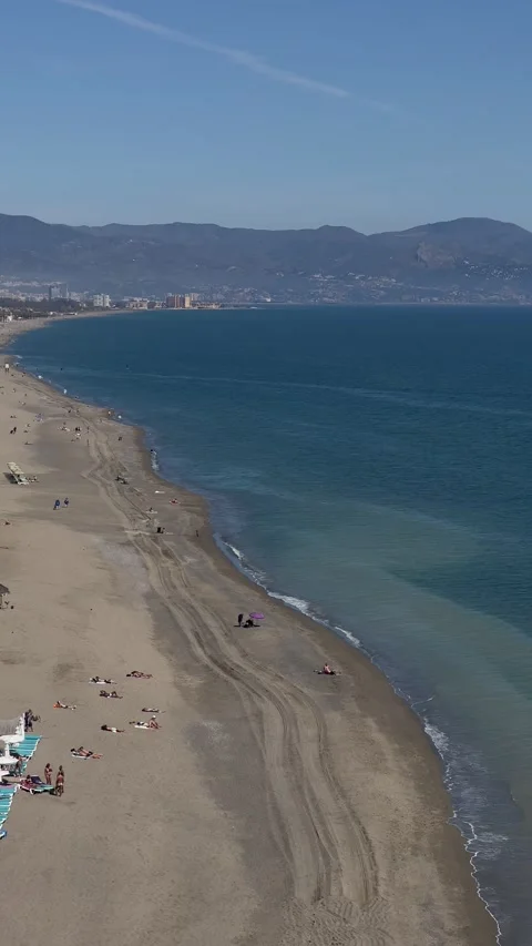 View of beach in Torremolinos and Malaga coast from above. Vertical video Stock Footage 240919963