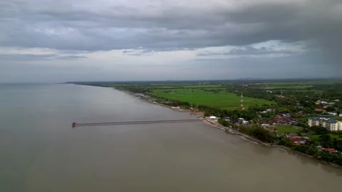 A view of a beach with a town in the background. Aerial view Yan, Kedah Video stock 325767313