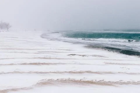 View of the beach in the winter during a snowfall Stock Photos