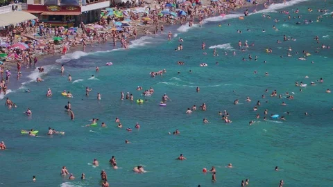 View of the beautiful beach where people are swimming Stock Footage 103408002