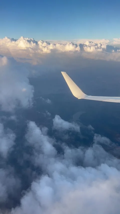 View of beautiful clouds from a plane window Stock Footage 336912391