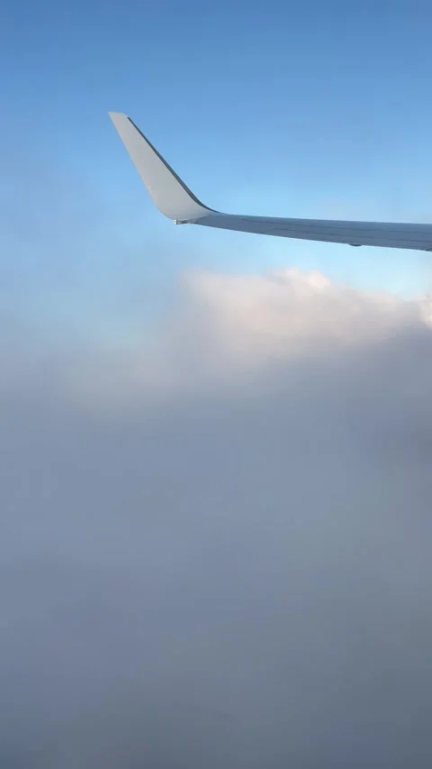 View of beautiful clouds from a plane window Stock Footage 336912842