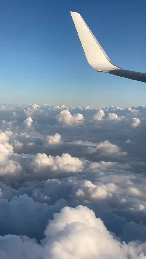 View of beautiful clouds from a plane window Stock Footage 336912861