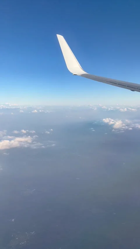 View of beautiful clouds from a plane window Stock Footage 336912865