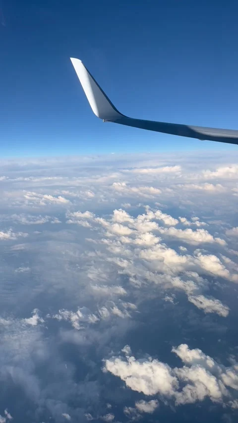 View of beautiful clouds from a plane window Stock Footage 336912934