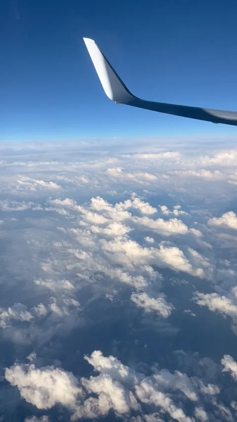 View of beautiful clouds from a plane window Stock Footage 336912935