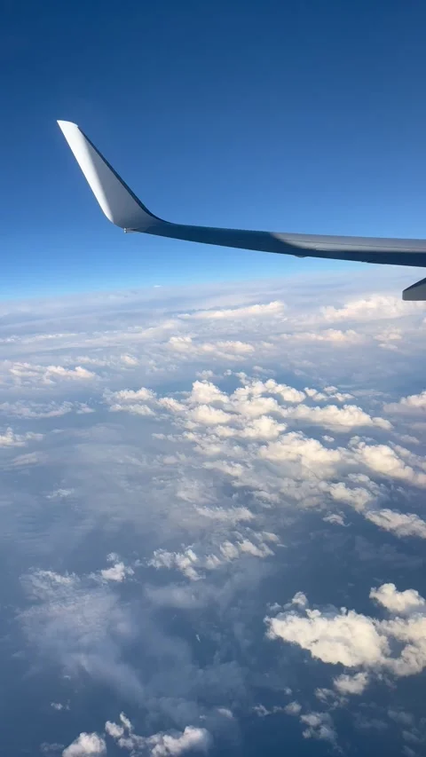 View of beautiful clouds from a plane window Stock Footage 336912936