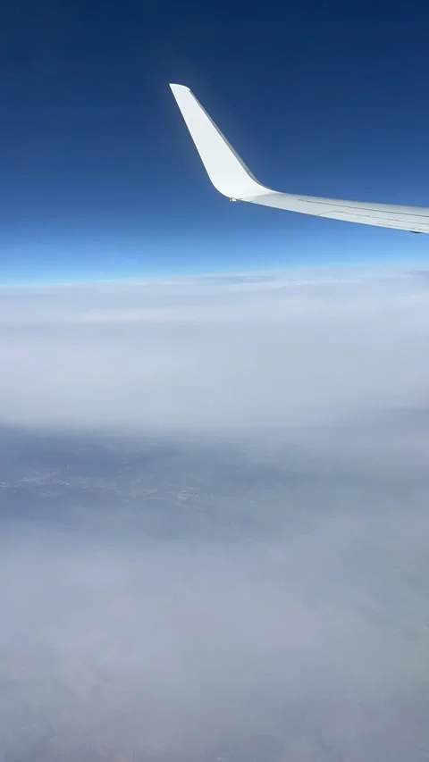 View of beautiful clouds from a plane window Stock Footage 336912956