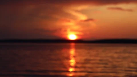 View of a beautiful evening summer sunset through the clouds with the reflection Video stock 280549016