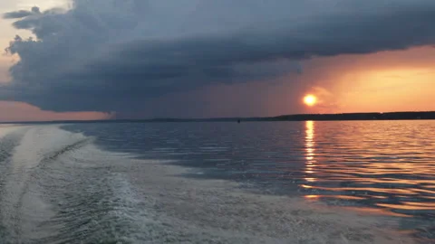 View of a beautiful evening summer sunset through the clouds with the reflection Video stock 280549241
