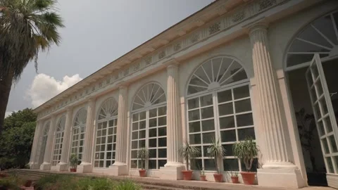 View of beautiful green garden in front of museum, Museo Pignatelli in Naples Stock Footage 274437041