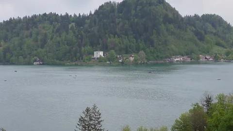 View of the beautiful Lake Bled in the spring evening Stock Footage 101766718