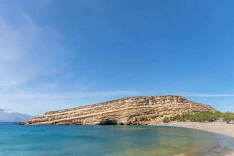 View of beautiful Matala beach with cliffs on the Crete island. Stock Photos