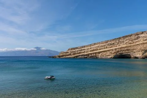 View of beautiful Matala beach with cliffs on the Crete island. Stock Photos