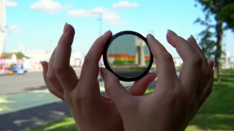 View of a beautiful multi-colored building through round tinted glass. Stock Footage 201097170
