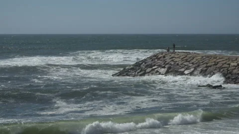 View of a beautiful ocean sandy beach with the blue waves rolling into the shore Stock Footage 91271150