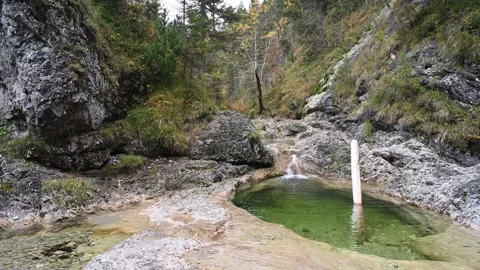 View of a beautiful pond of a mountain stream in autumn Stock Footage 260865224