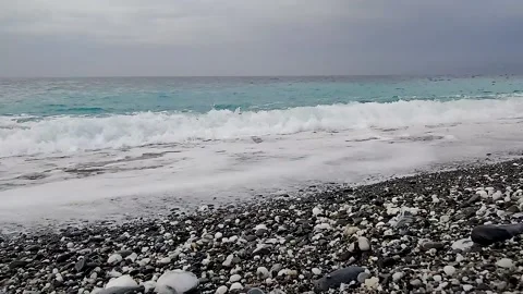 View of the beautiful shots while the turquoise sea waves crash  Stock Footage 250396702