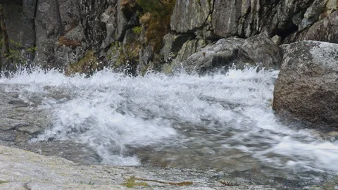 View of beautiful small stream falling dawn through stone from the T Stock Footage 120159539