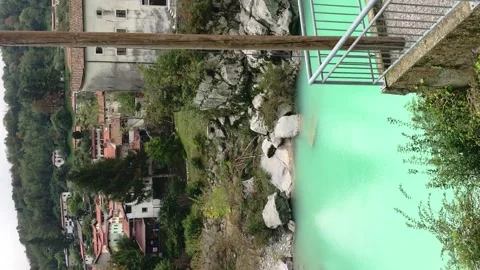 View of the beautiful Soča river with stunning green water against the bridge. Video stock 153662059