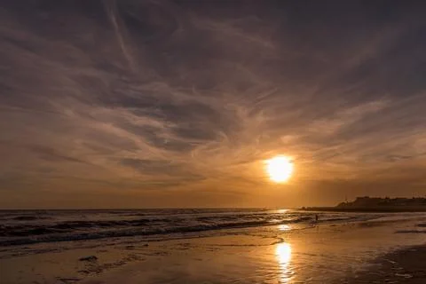 View of a beautiful sunset at the beach. Stock Photos