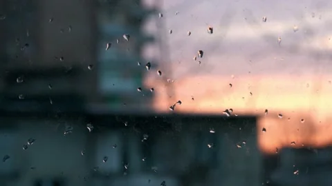 View of a beautiful sunset over the city through dirty windows Stock Footage 159440587