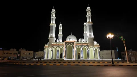 A view of a beautifully illuminated mosque at night in Sharjah, United Arab 動画素材 332047405