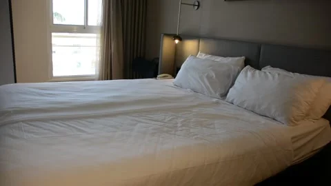 View on the bed in hotel room Видео 285263989