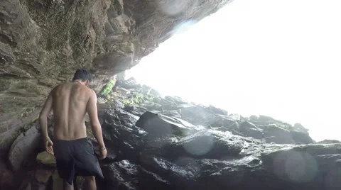 A view behid a raging and roaming waterfall Stock Footage 58647178