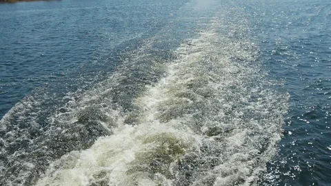View from behind a big ship in the river on the foaming water. Slow motion Vidéo 108044879