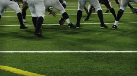 A view from behind the offensive line before the snap Stock Footage 33871030