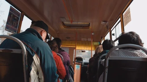 View from behind, passengers ride the bus. Autumn weather. Bus shakes on a bad r 스톡 동영상 119309083