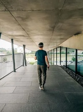 The view from behind walking a man in casual clothes Stock Photos