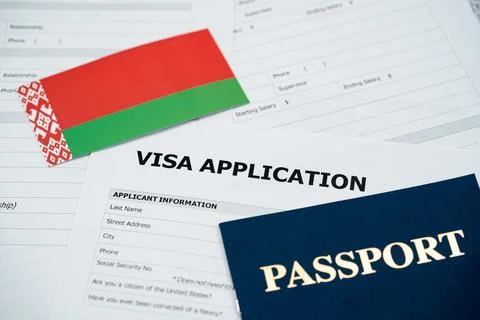 View of Belarus visa application form with passport and national flag Stockfoto's