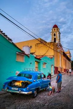 View of Bell Tower and broken car Фото
