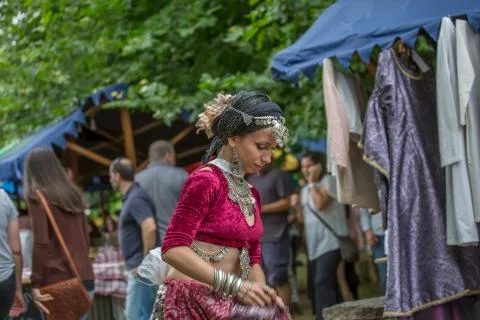 View of a belly dancer, dressed in typical clothes, in medieval fair Stock Photos