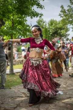 View of a belly dancer, dressed in typical clothes, in medieval fair Stock Photos
