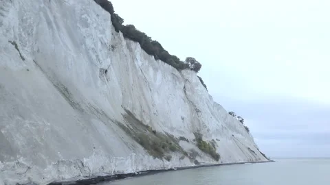 View from below of a beautiful cliff by the sea in Denmark Stock Footage 221614003