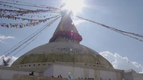 View from below of Buddhist Stupa in the sunlight, birds flying 動画素材 46016915