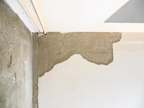View from below of ceiling with chipped plaster Stock Photos