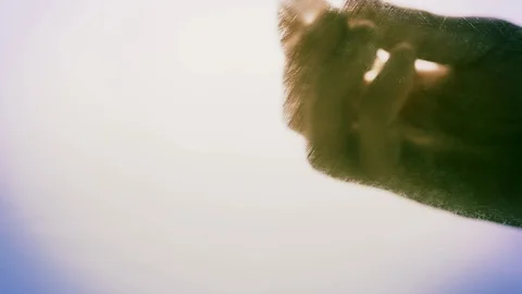 View from below as a cooking brush smears ketchup with herbs for cooking steak Stock Footage 122619758