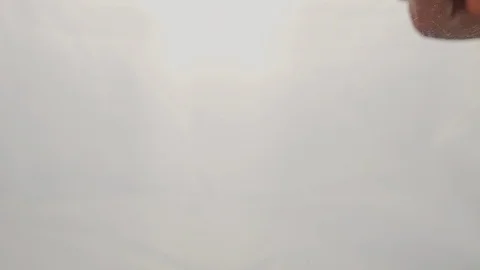 View from below as a cooking brush smears ketchup with herbs for cooking steak Stock Footage 122621326